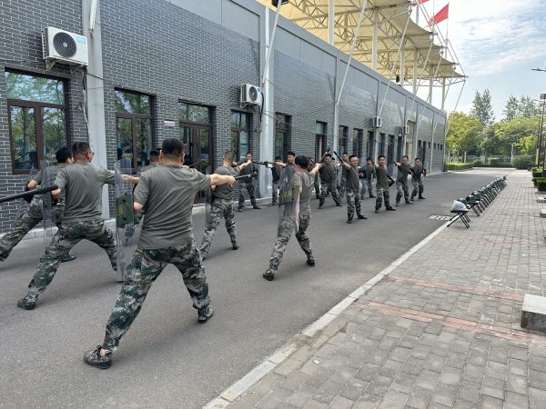 1693990412601071.jpeg 渭化集團民兵集訓警棍盾牌會操.jpg